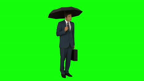 Geschäftsmann-Steht-Unter-Regenschirm