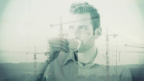 Construction-overlay-on-businessman-drinking-coffee