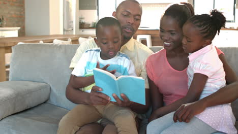 Parents-and-children-sitting-on-couch-reading