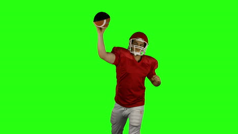 Red-american-football-player-send-the-ball