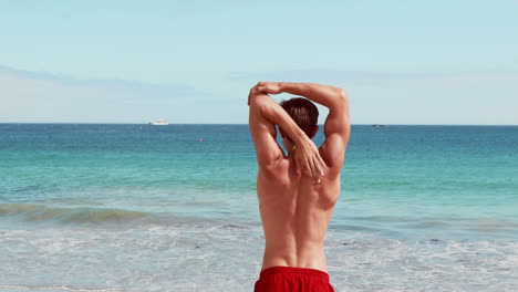 Attractive-man-stretching-his-arms