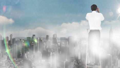 Businessman-on-ladder-looking-at-skyscraper-with-binoculars-