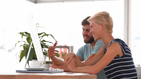 Casual-business-team-working-on-computer