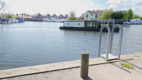 Barge-boat-leaving-Beccles-Marina-sails-along-River-Waveney-Suffolk