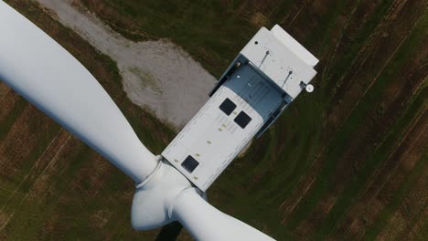 Wind-Turbine-Top-Down-View-from-Drone-Spirling-for-Inspection,-Close-Up-Shot