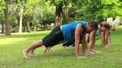 Fitness-group-doing-yoga-in-park