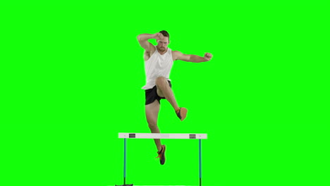 Athlete-man-running-and-jumping-over-hurdle