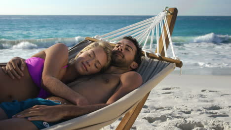 Couple-relaxing-in-hammock-
