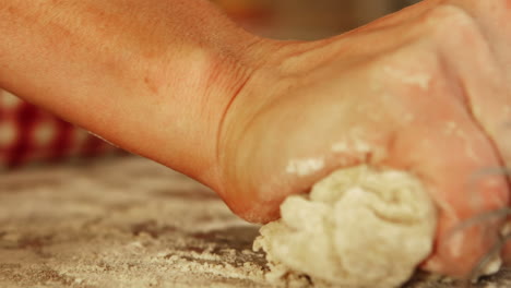 Woman-hands-kneading-dough