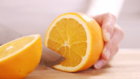 Close-up-on-a-woman-carving-a-orange-