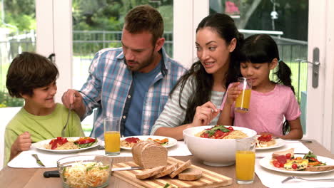 Happy-family-having-lunch