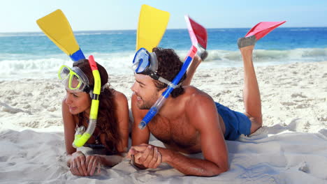 Happy-couple-with-snorkeling-equipment-talking