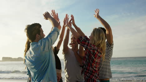 Group-of-friends-doing-high-five