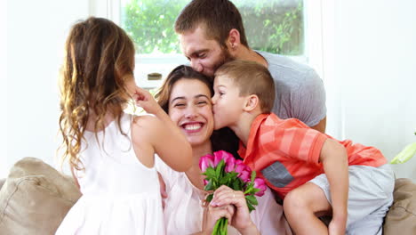 Mom-receiving-flowers-and-kisses