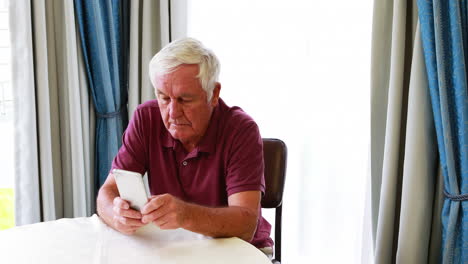 Retired-man-using-smartphone-