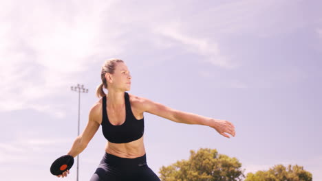 Sportswoman-practicing-discus