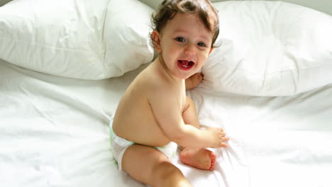 Cute-baby-playing-on-a-bed-