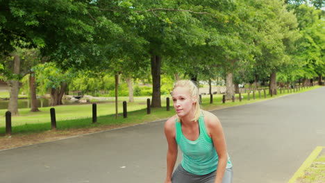 Fit-woman-stretching-in-the-park