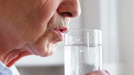 Senior-man-drinking-a-water-glass