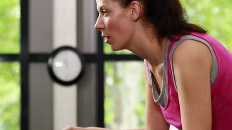 Fit-woman-using-exercise-bike