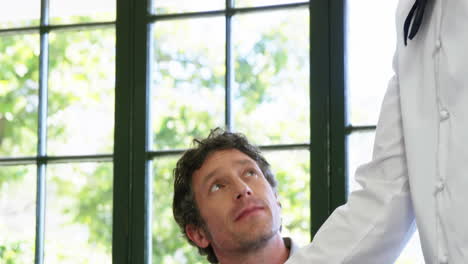 Cute-couple-is-being-waited-on-a-glass-during-lunch-meeting