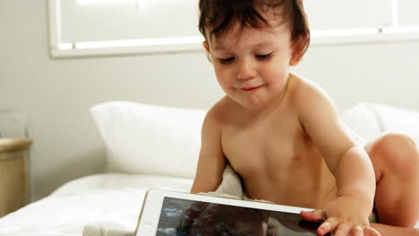 Baby-playing-with-a-tablet