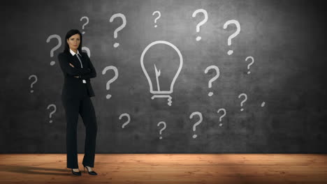 Businesswoman-standing-against-question-marks-and-bulb