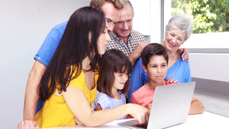 Happy-family-using-a-laptop