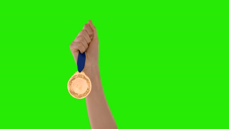 Hand-holding-a-medal-