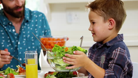 Boy-giving-the-salad-plate-