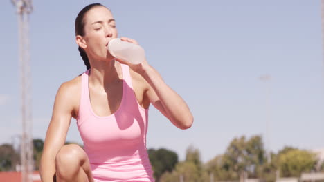 Sportswoman-drinking-water