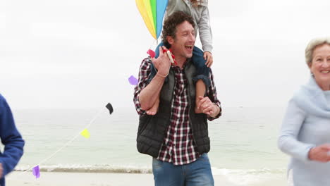 Happy-family-running-with-kite