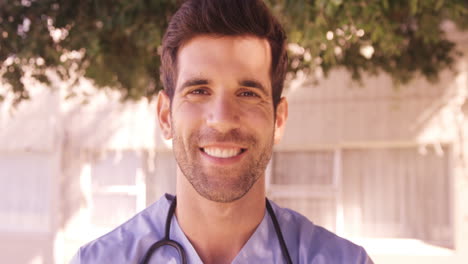 Portrait-of-male-doctor-smiling-in-the-backyard