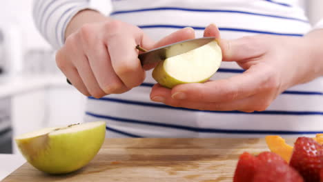 Close-up-on-a-woman-carving-some-fruits