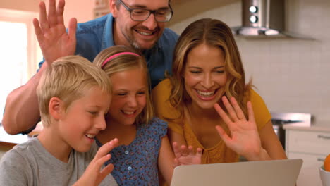 Cute-family-doing-a-video-chat-on-the-laptop