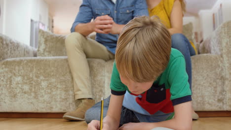 Parents-watching-their-son-do-homework