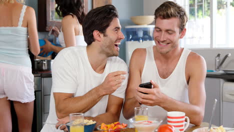 Cute-couples-cooking-and-laughing-in-kitchen