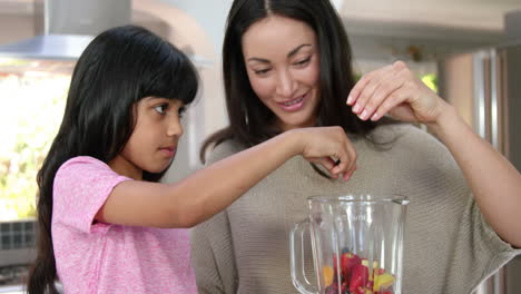 Mother-and-daughter-making-smoothies