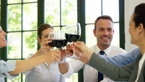 Business-people-are-toasting-with-a-red-wine
