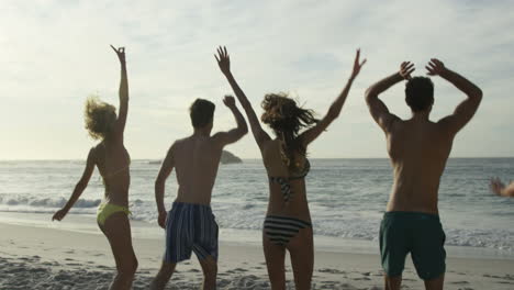 Friends-jumping-on-the-beach-