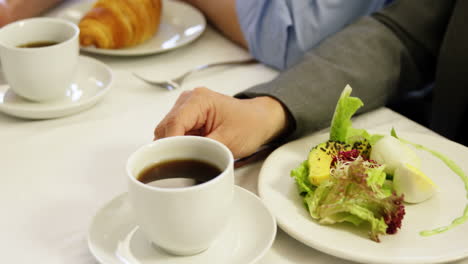 Business-team-having-a-meeting-in-restaurant