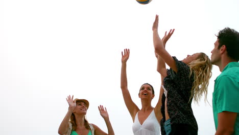 Smiling-friends-playing-beachball