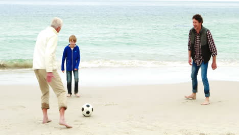 Family-playing-football-together