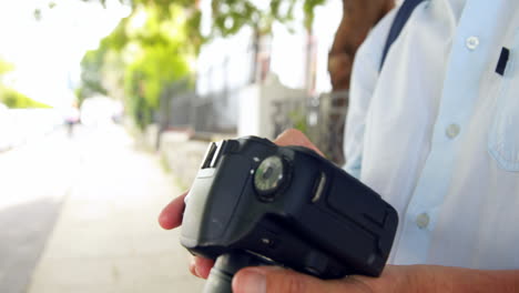 Smiling-man-taking-pictures