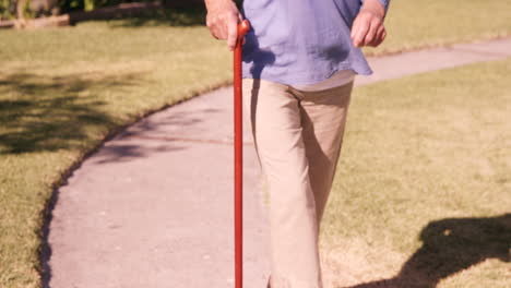 Senior-woman-walking-in-the-backyard