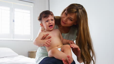 Mother-trying-to-calm-her-baby