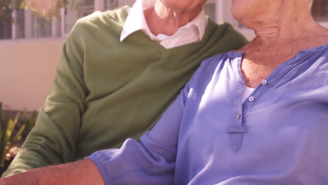 Senior-couple-sitting-together