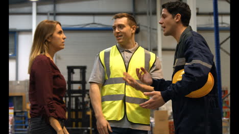 Warehouse-worker-talking-with-management