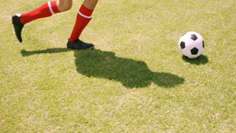 Football-player-dribbling-the-ball