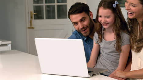 Family-using-laptop-in-kitchen